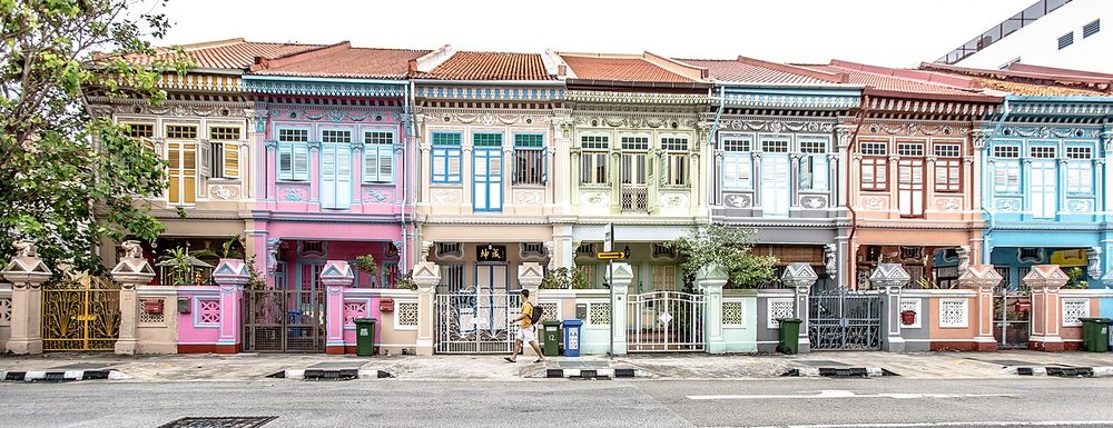 A long row of pastel-coloured, ornately decorated Peranakan terrace houses on Koon Seng Road in Joo Chiat, Singapore